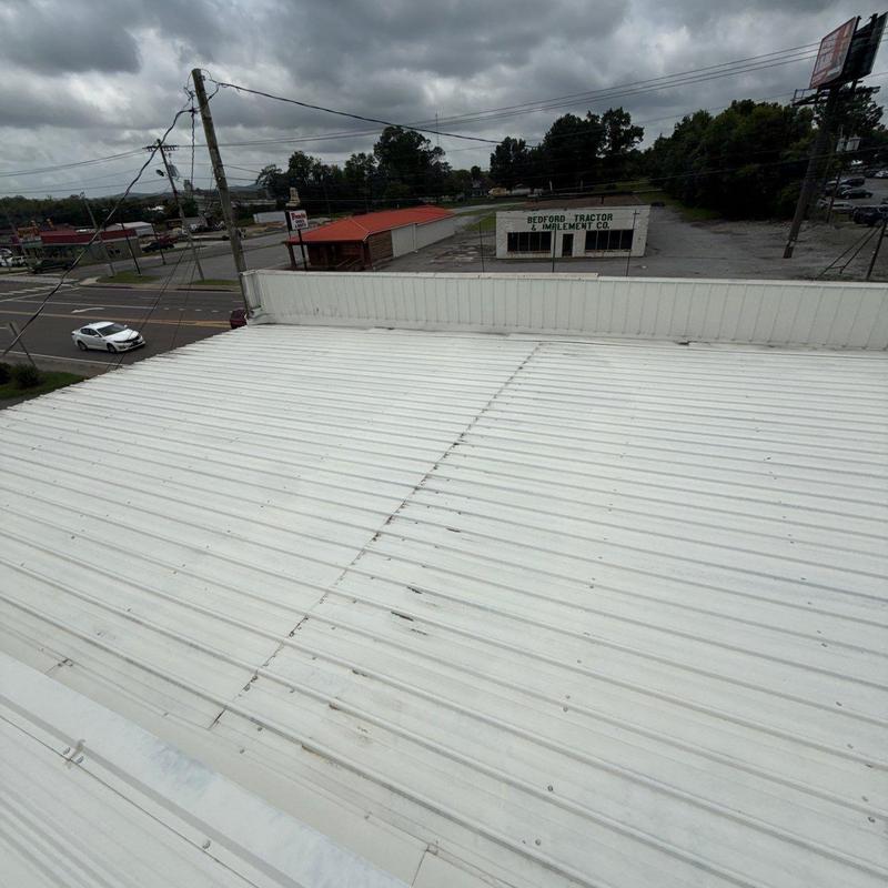 Metal roof with minor hail damage and wear signs