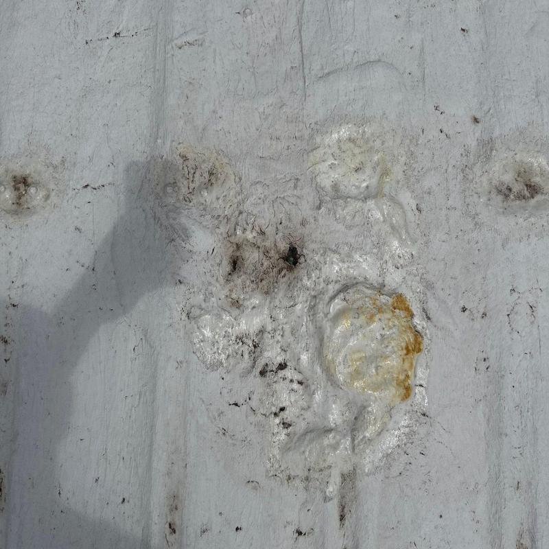 Metal roof hail damage with rust spots