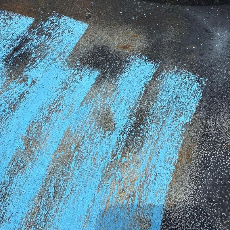 Roof shingles with hail and wind damage markings