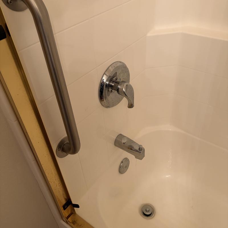 Shower valve and bathtub faucet in white tub Shower valve and bathtub faucet in white tub