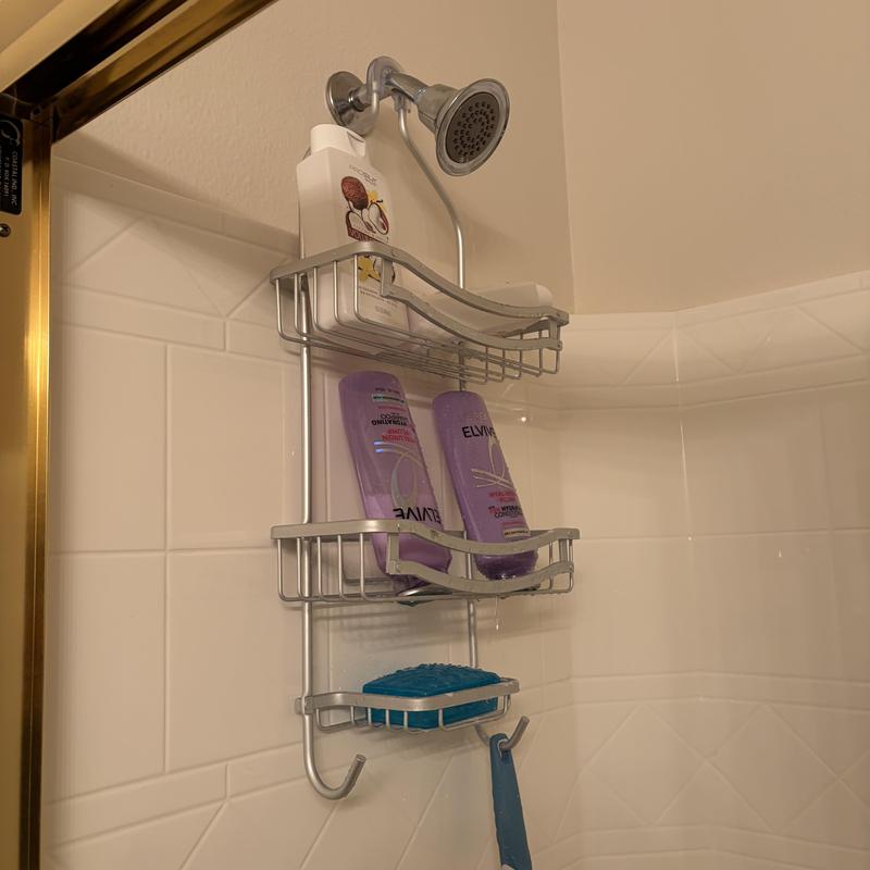Shower head and wall-mounted soap rack with toiletries Shower head and wall-mounted soap rack with toiletries