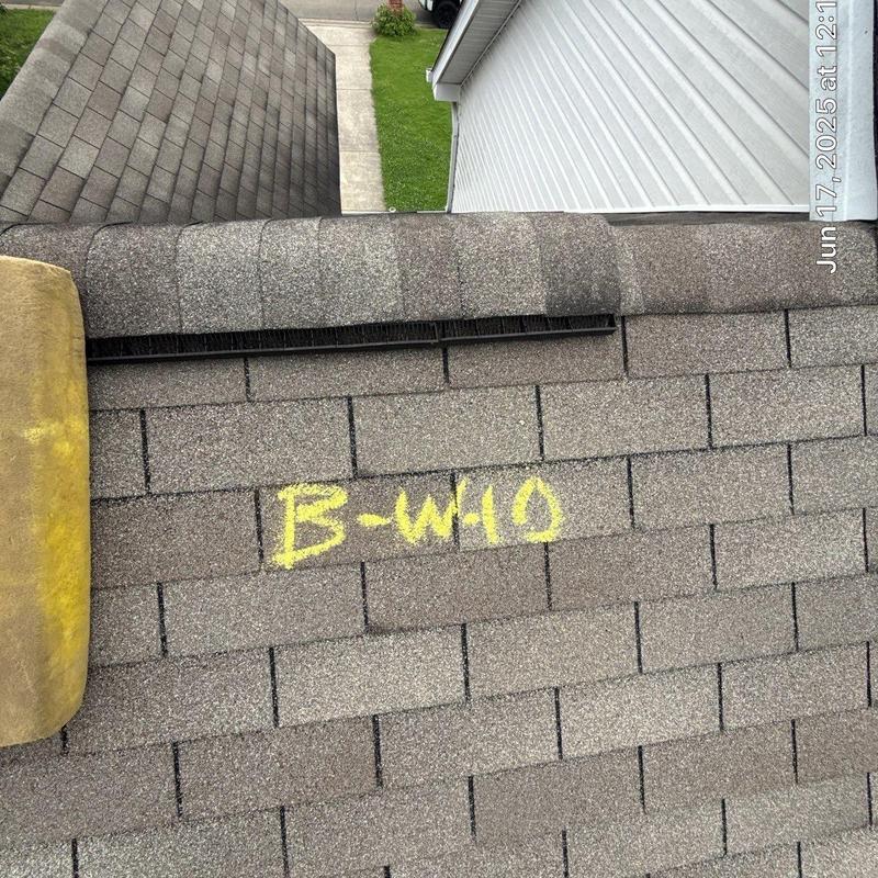 Roof shingles with chalk marking and ridge vent installation