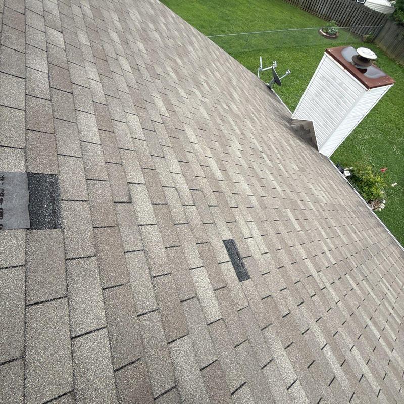 Asphalt shingle roof with hail damage and granule loss