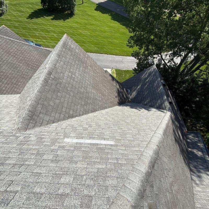 Asphalt shingle roof with hail damage inspection
