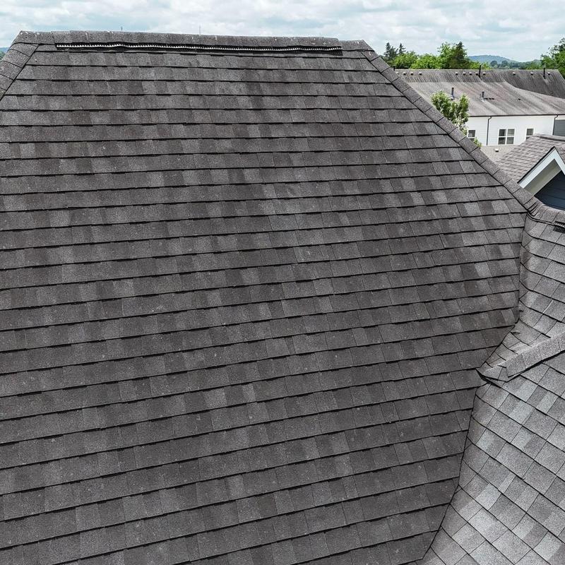 Asphalt shingle roof with hail damage and wear