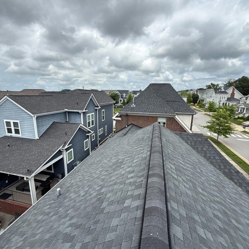 Asphalt shingle roof with hail damage and aging signs
