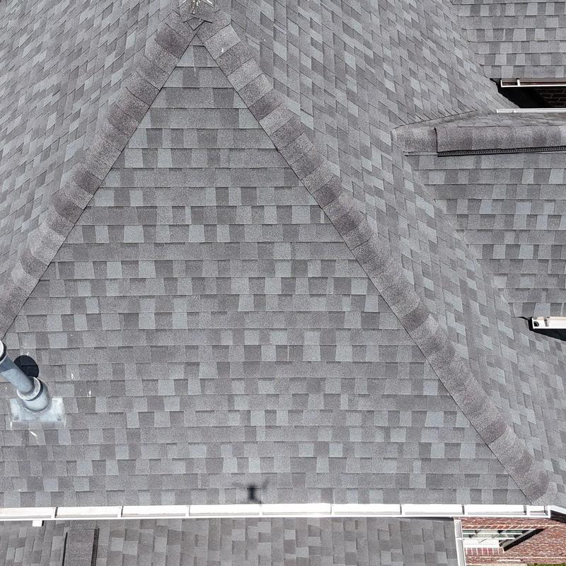 Asphalt shingle roof with hail damage inspection