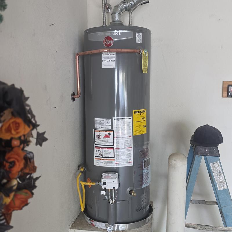 Gas water heater installation with vent and piping