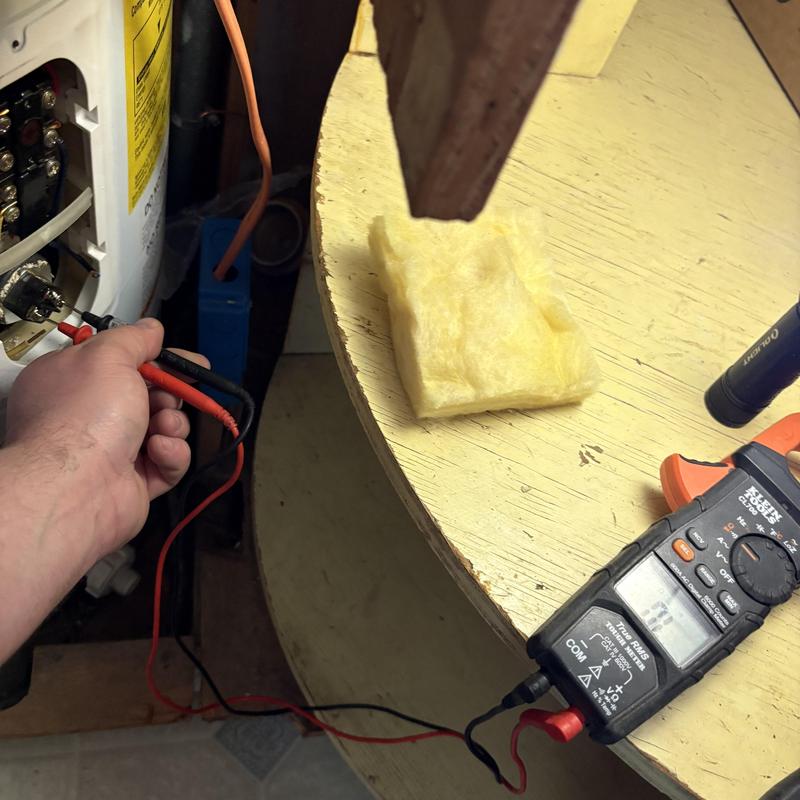 Water heater elements testing with multimeter under cabinet Water heater elements testing with multimeter under cabinet