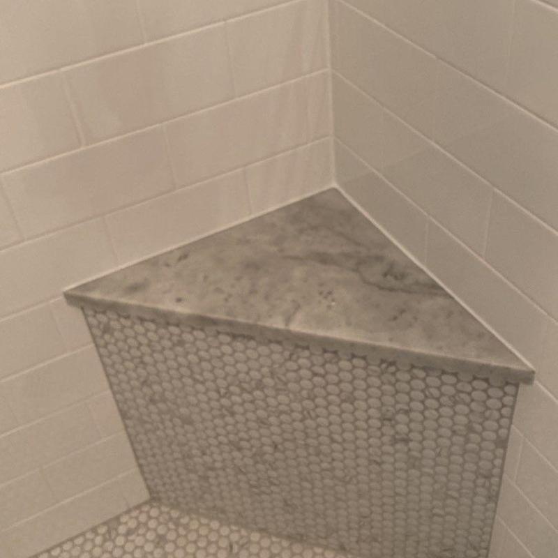 Shower bench with hex tile and marble top