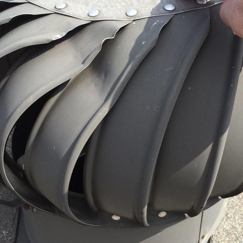 Turbine roof vent with bent metal blades
