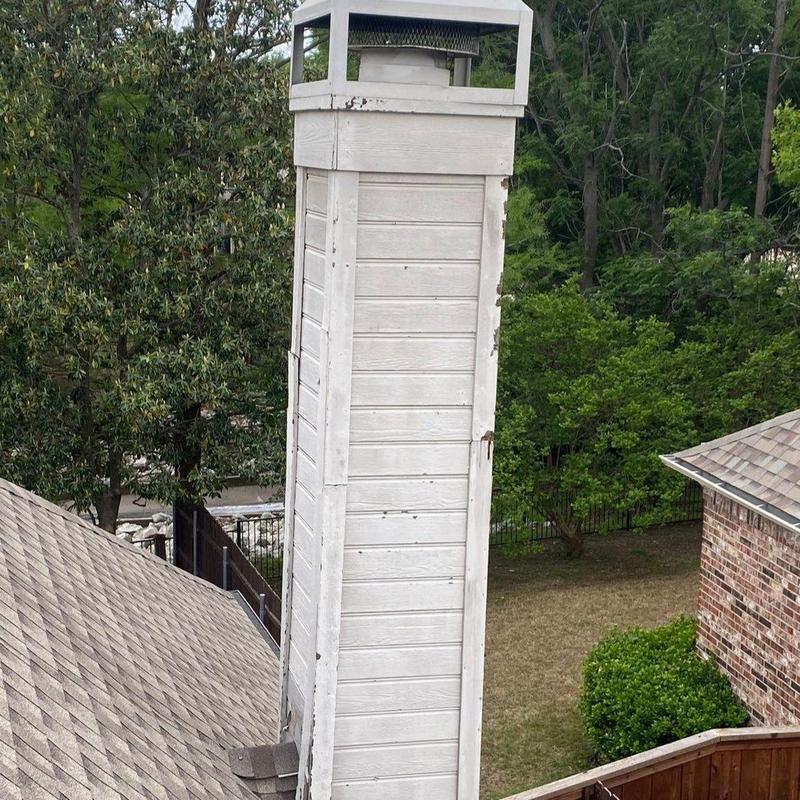 Chimney chase siding and trim with weather damage