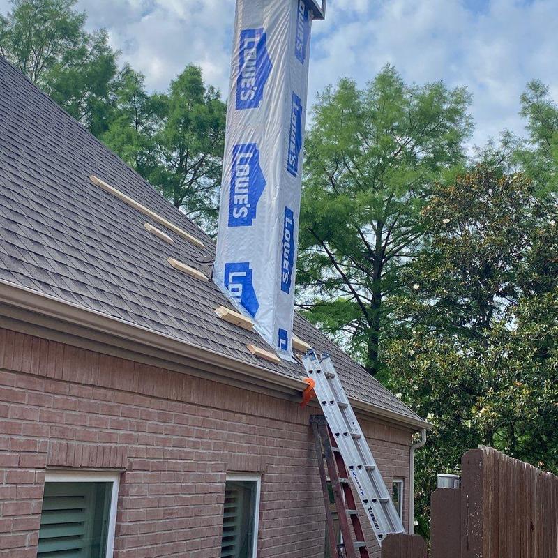 Chimney chase with new vapor barrier and siding installation