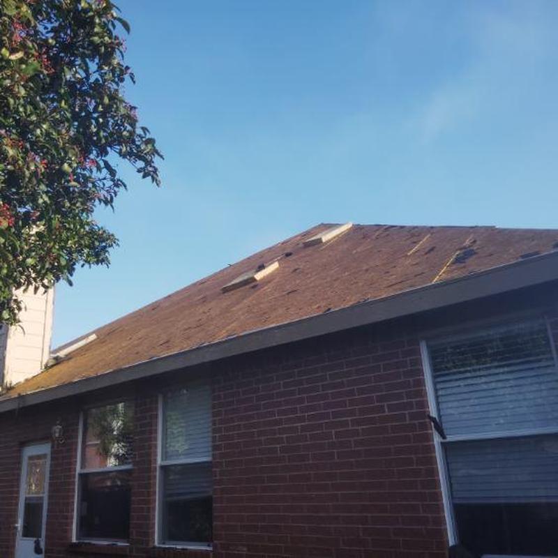 Roof decking exposed during shingle removal in McKinney TX