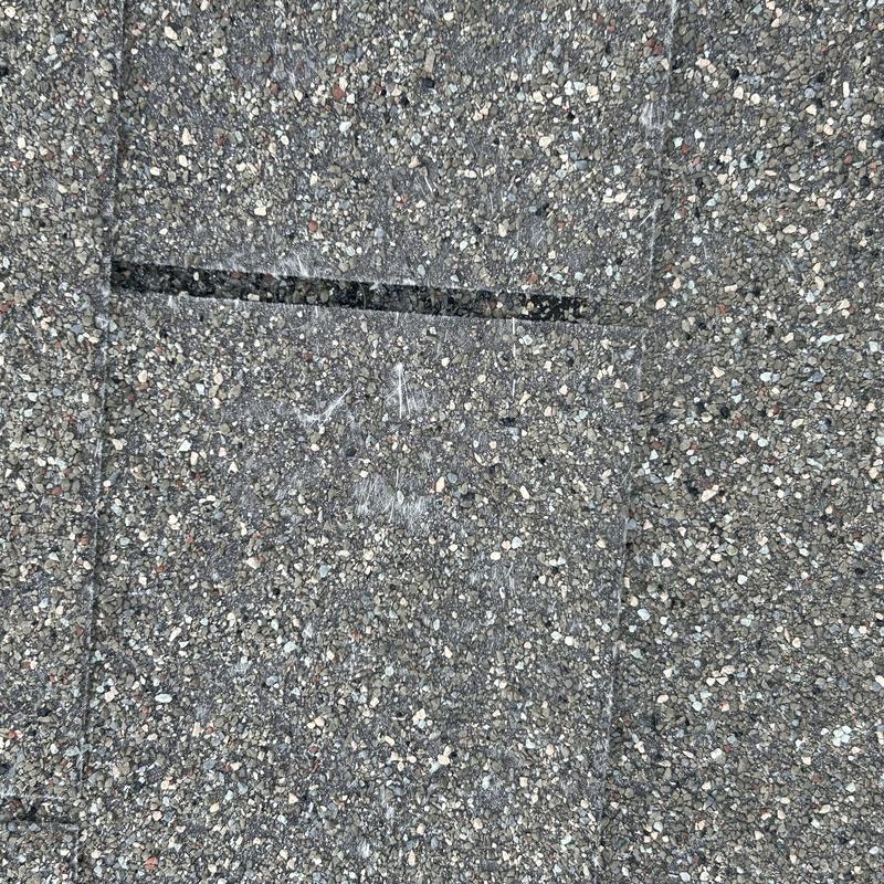 Asphalt shingle roof patch with worn granules