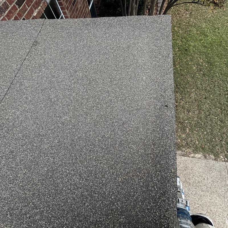 Driftwood flat roof installation on front porch