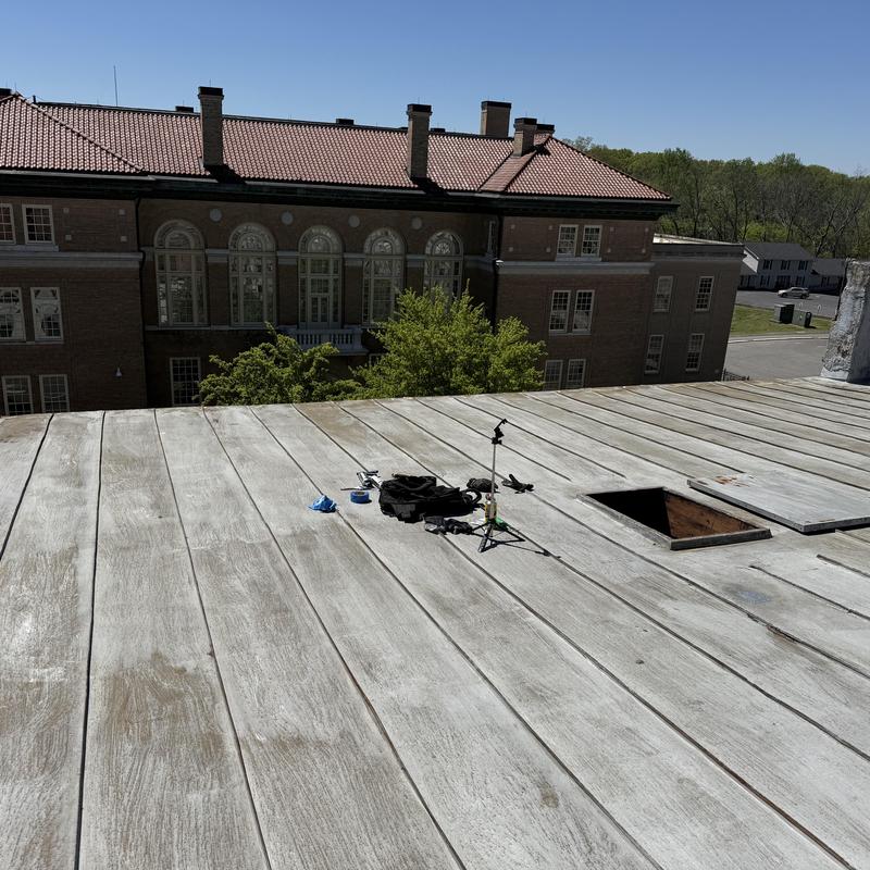 Standing seam metal roof with surface prep tools