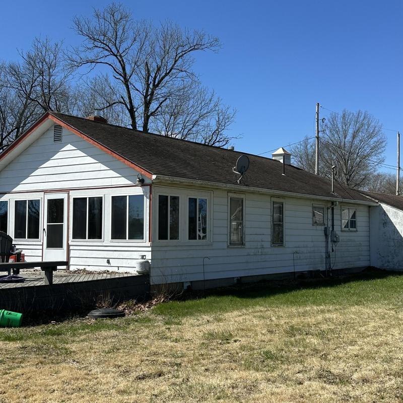 Siding and gutter estimate on residential house exterior Siding and gutter estimate on residential house exterior