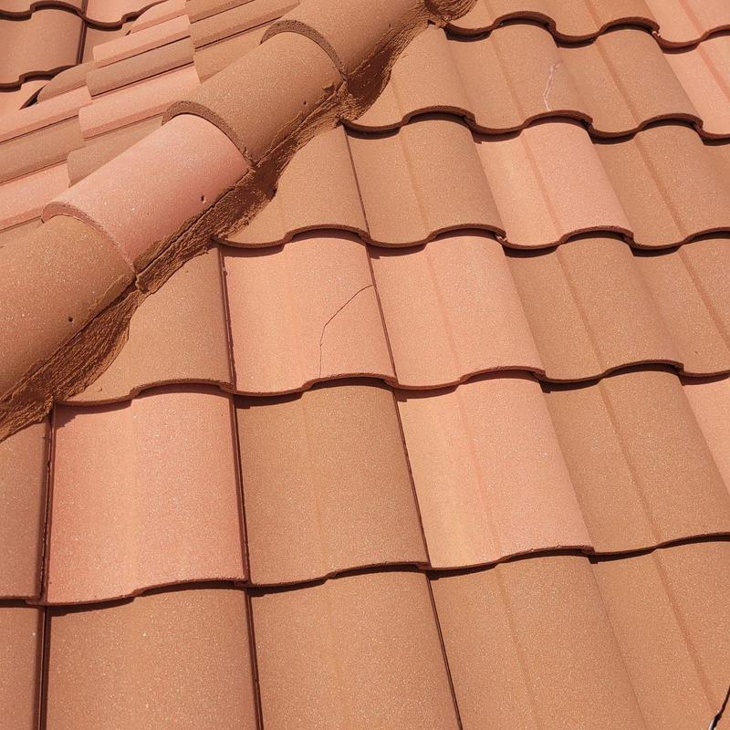 Tile roof with cracked and displaced tiles repair