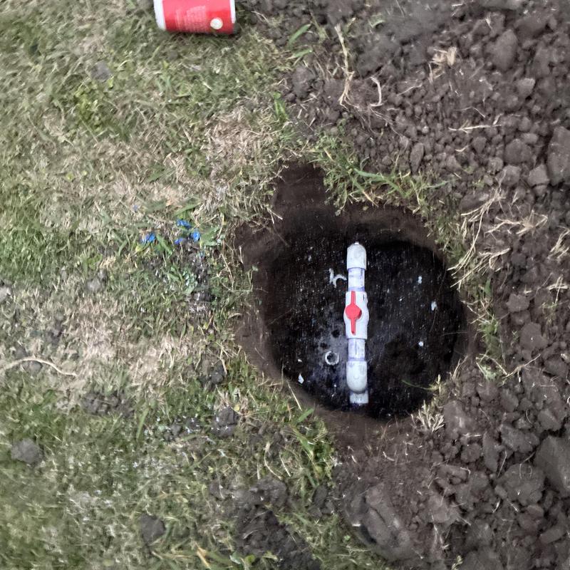 Water service line shutoff valve in ground hole