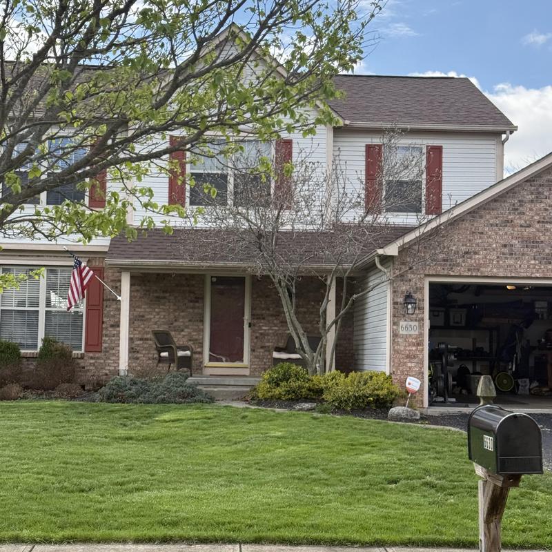 Vinyl siding inspection on two-story house exterior Vinyl siding inspection on two-story house exterior