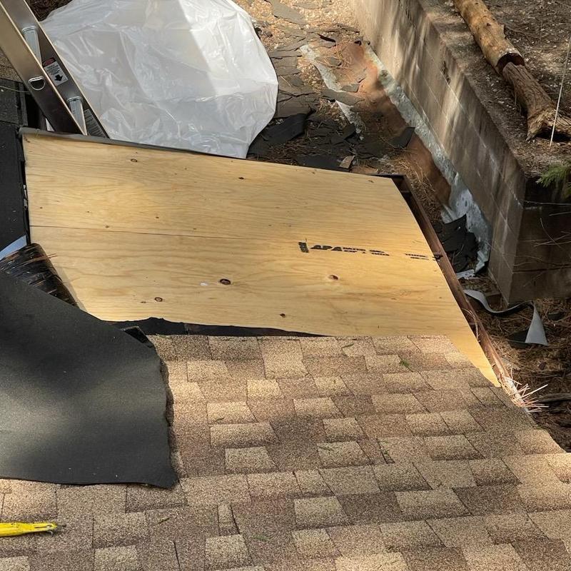 Asphalt shingle roof deck with new plywood installed