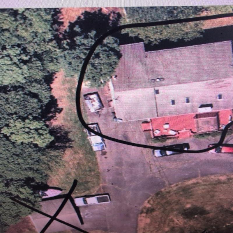 Flat roof inspection outline on commercial building