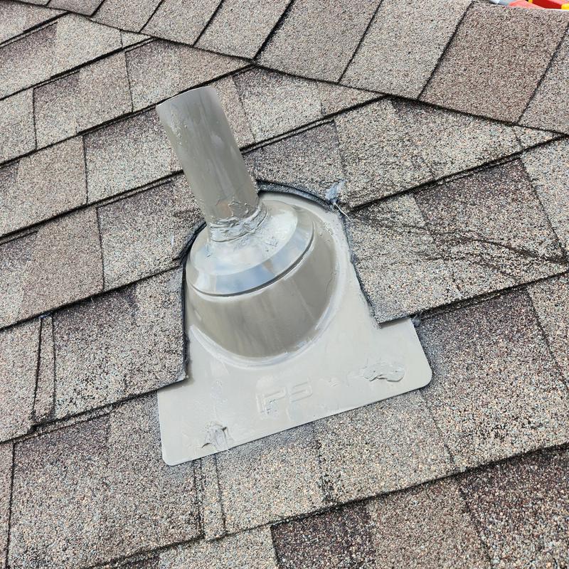 Plumbing boot sealed on asphalt shingle roof Plumbing boot sealed on asphalt shingle roof