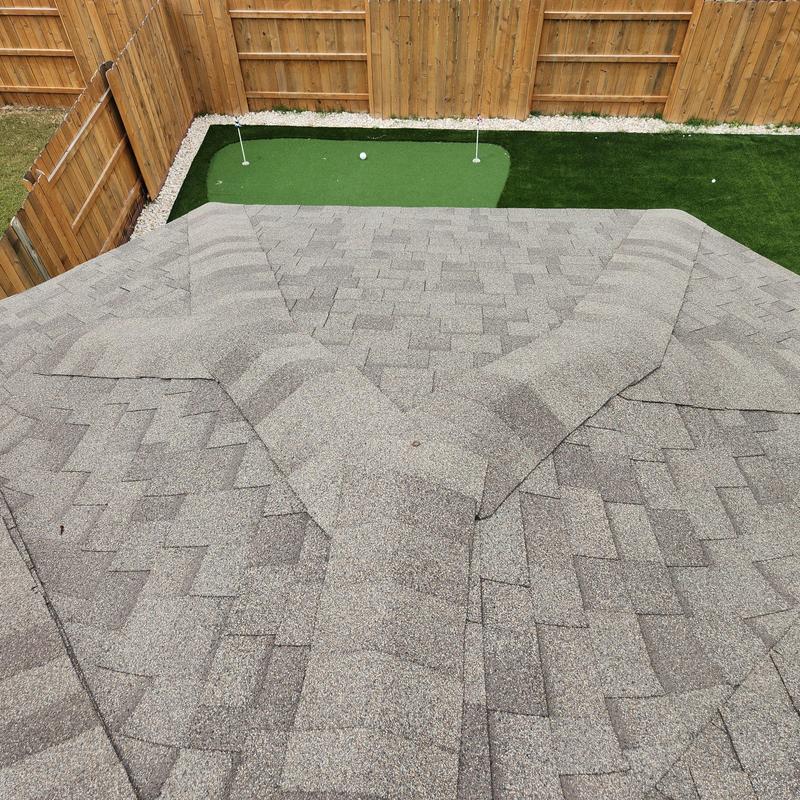 Asphalt shingle roof with sealed lifting shingles Asphalt shingle roof with sealed lifting shingles