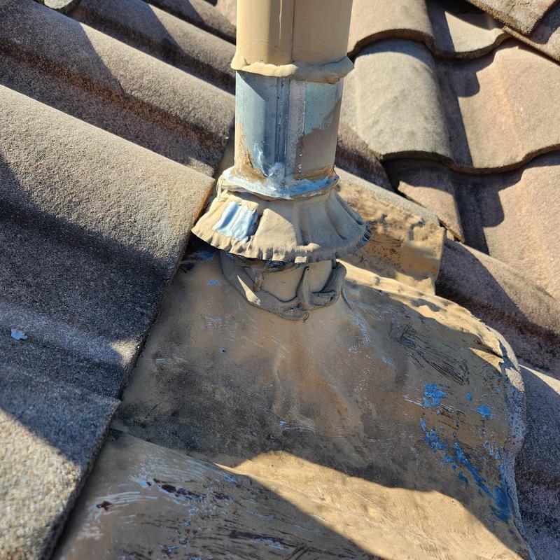 Roof vent flashing with sealant and tile roof Roof vent flashing with sealant and tile roof