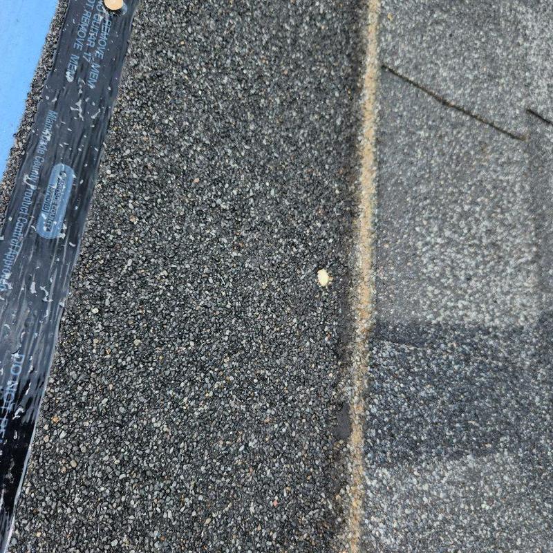 Charcoal black shingles and sealed roofing edge Charcoal black shingles and sealed roofing edge
