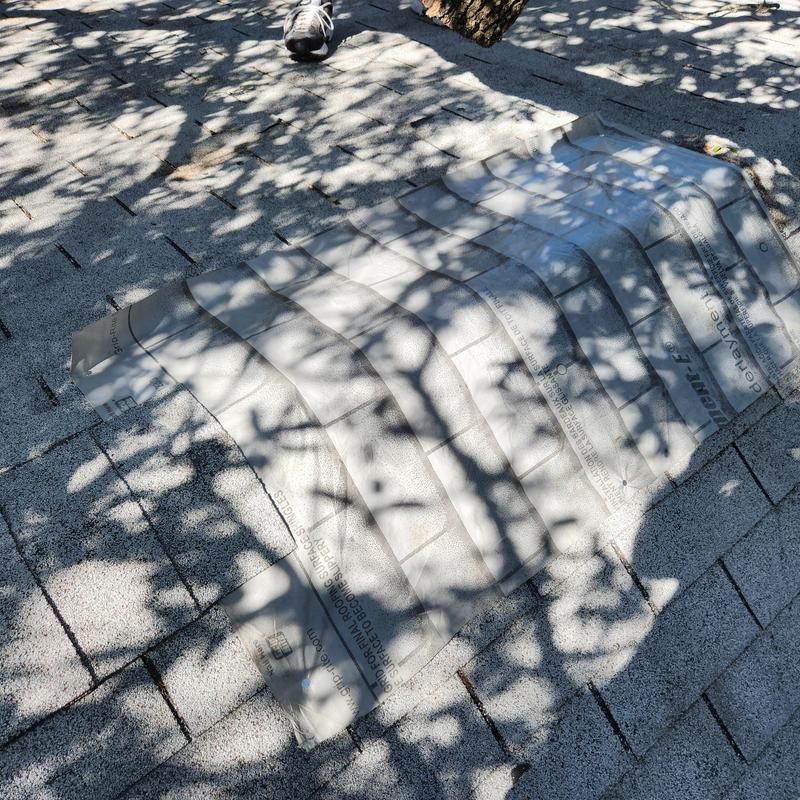 Slate shingles with protective underlayment on roof repair Slate shingles with protective underlayment on roof repair