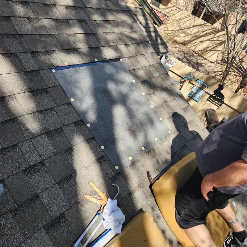 Temporary roof patch with fasteners on shingles Temporary roof patch with fasteners on shingles