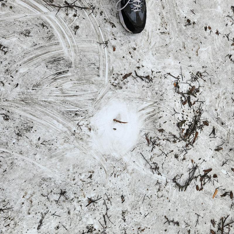 TPO roofing heat patch seal with debris and shoe visible