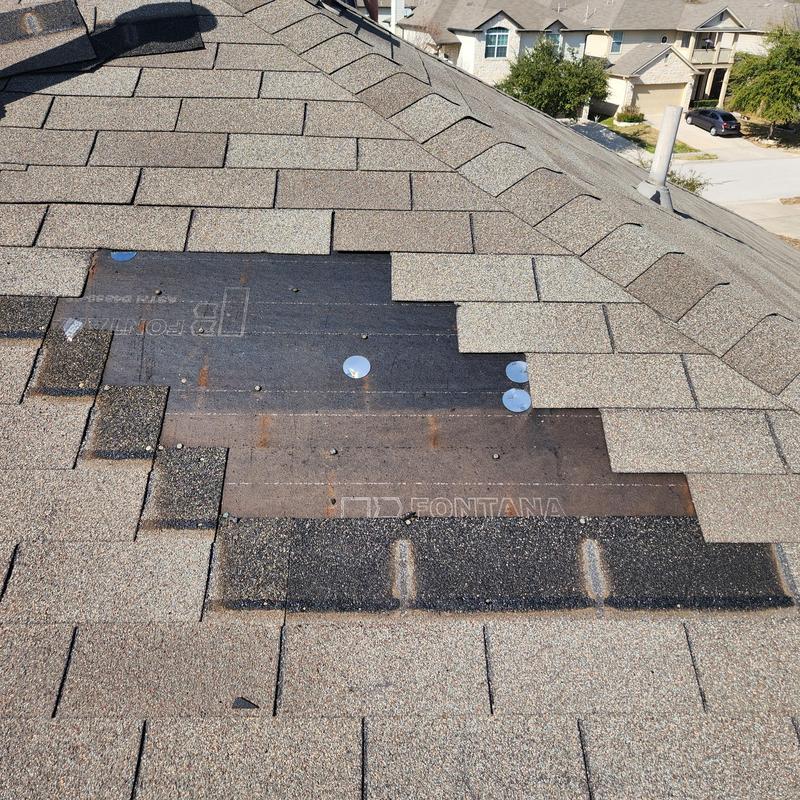 GAF weather gray shingles with missing panel on roof GAF weather gray shingles with missing panel on roof