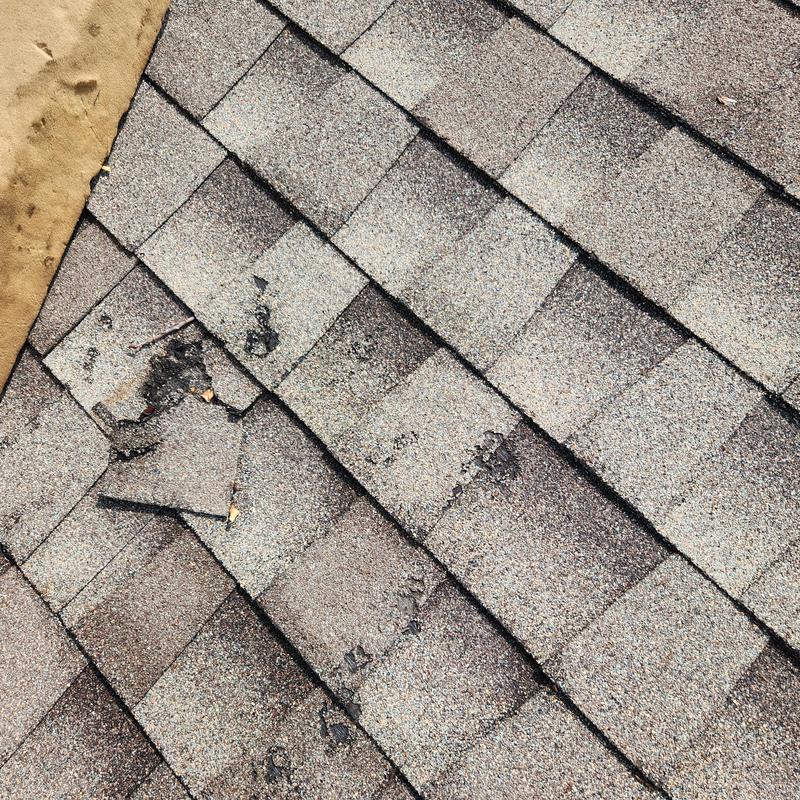 GAF Weather Gray roof shingles damaged and worn GAF Weather Gray roof shingles damaged and worn