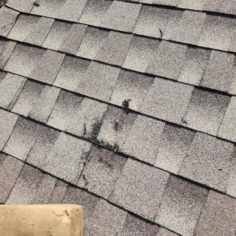GAF Weather Gray roof shingles with wear marks GAF Weather Gray roof shingles with wear marks
