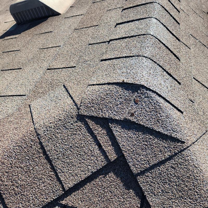 GAF Weather Gray roof shingles with uplift damage GAF Weather Gray roof shingles with uplift damage