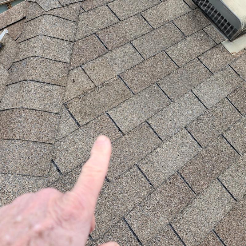 GAF Weather Gray shingles with granule loss on roof GAF Weather Gray shingles with granule loss on roof
