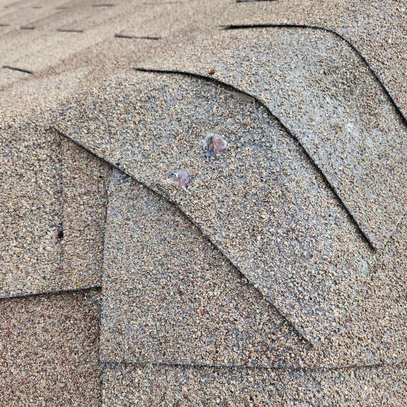 GAF Weather Gray shingles with sealant spots GAF Weather Gray shingles with sealant spots