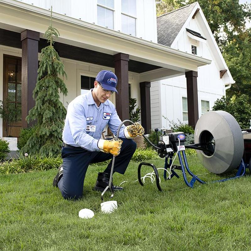 Kitchen sink drain cleaning with plumber and auger machine