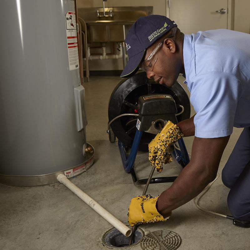Main line drain cleaning with auger and gloves