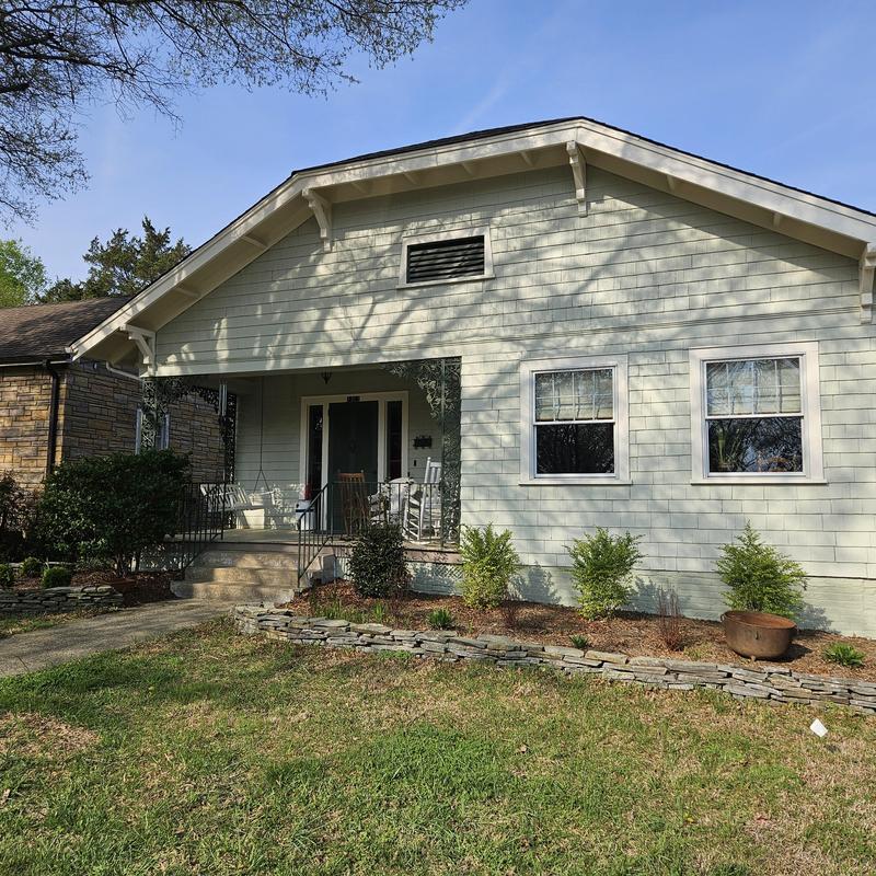 Three-season porch with handicap ramp and parking pad