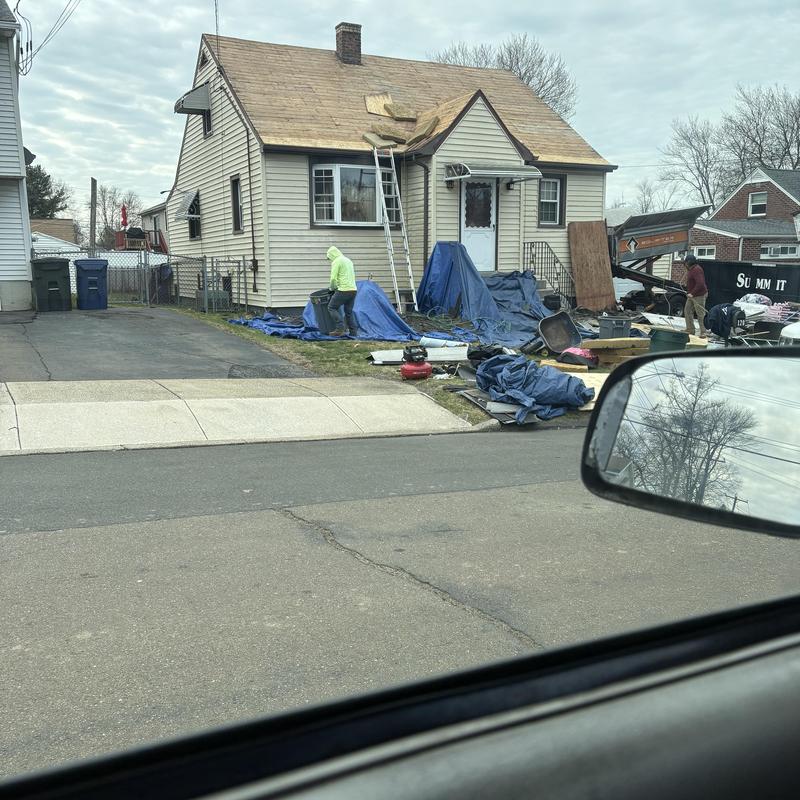 Roof decking removal with ladders and tarps