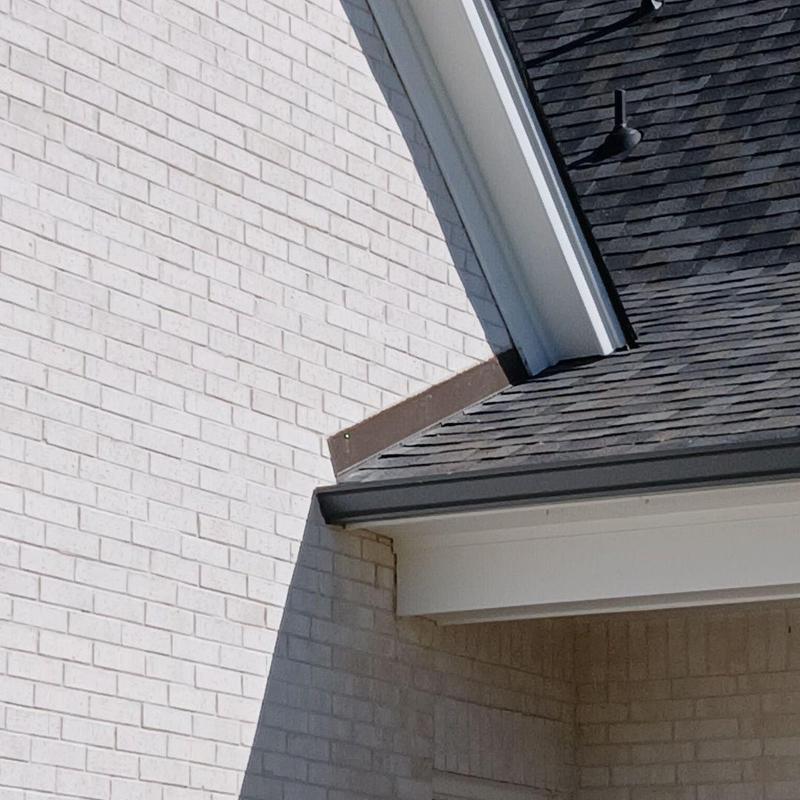 Reglet flashing installation on brick wall and roof junction