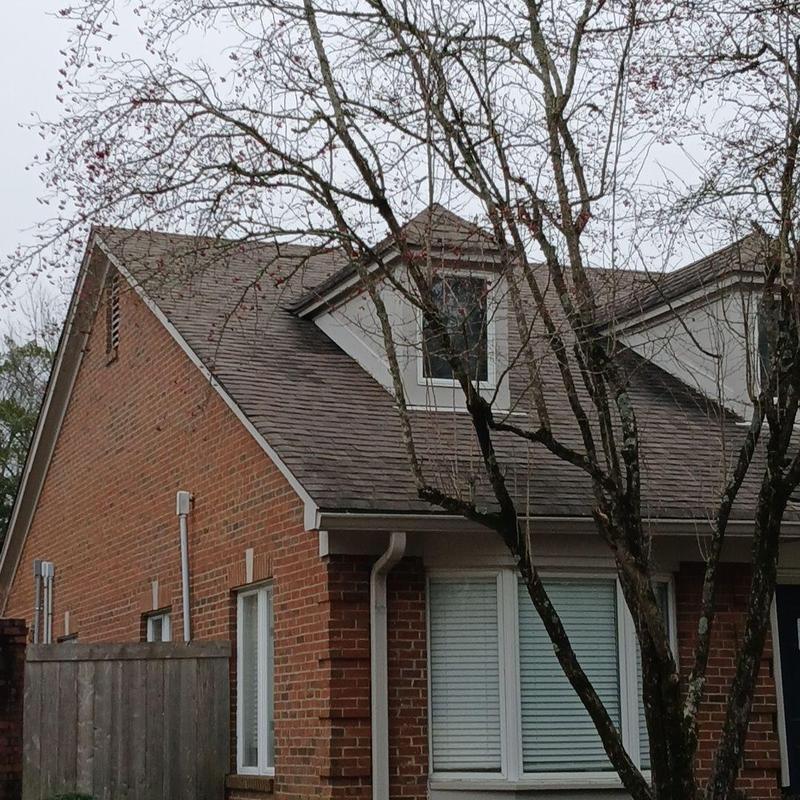 Dormer roof with new asphalt shingles and flashing
