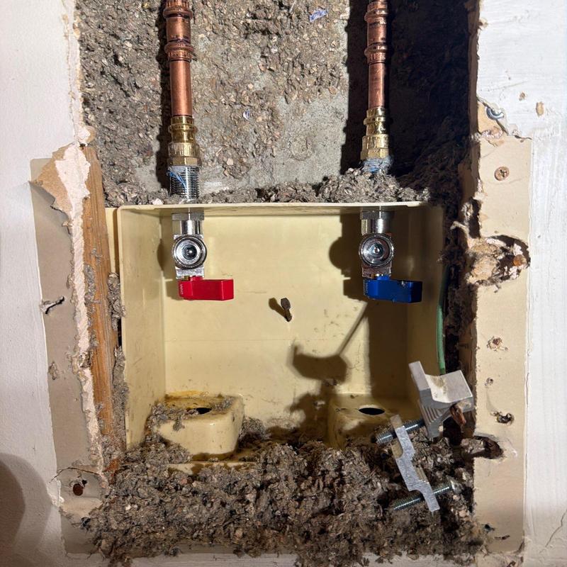 Quarter turn valves with red and blue handles installed