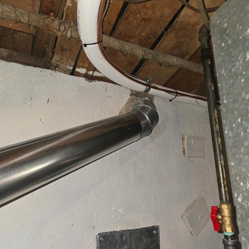 50-gallon water heater vent pipe installation in basement