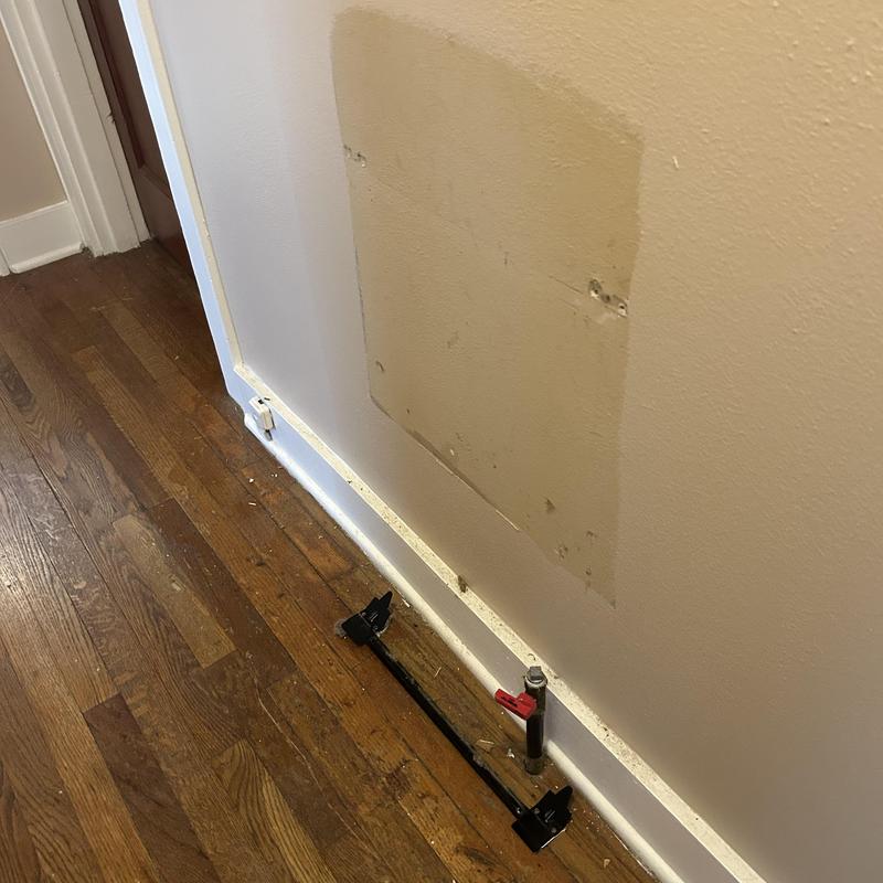 Gas wall unit disconnection and capping near floorboard