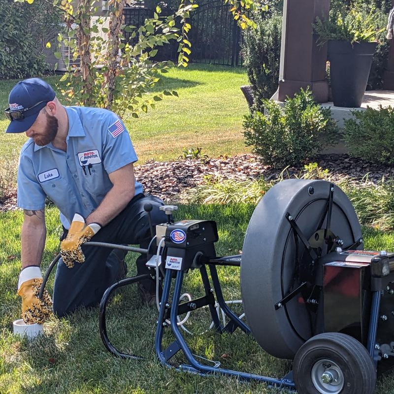 Main sewer line drain cleaning with cable machine